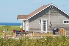 Small Brown Cottage and ocean